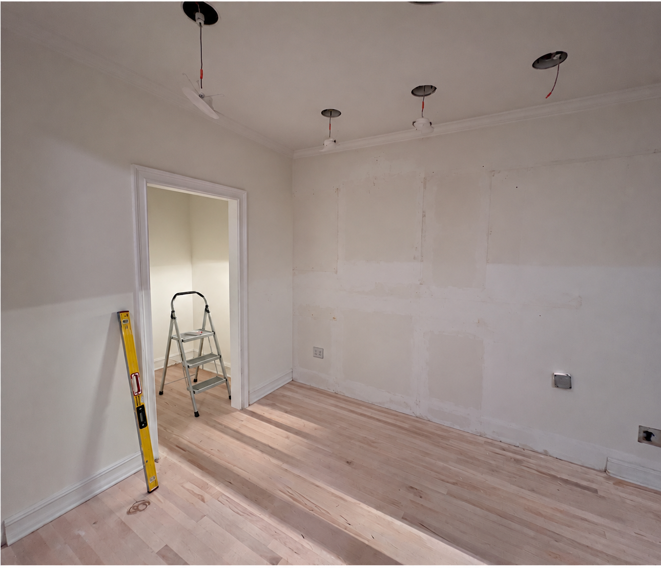 Kitchen cleared of cabinets and fixtures, ready for the next renovation stage